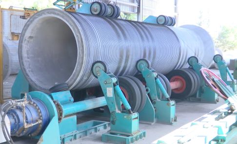 Rebar and rewire spun concrete process