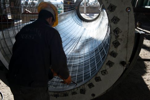 Rebar and rewire spun concrete process